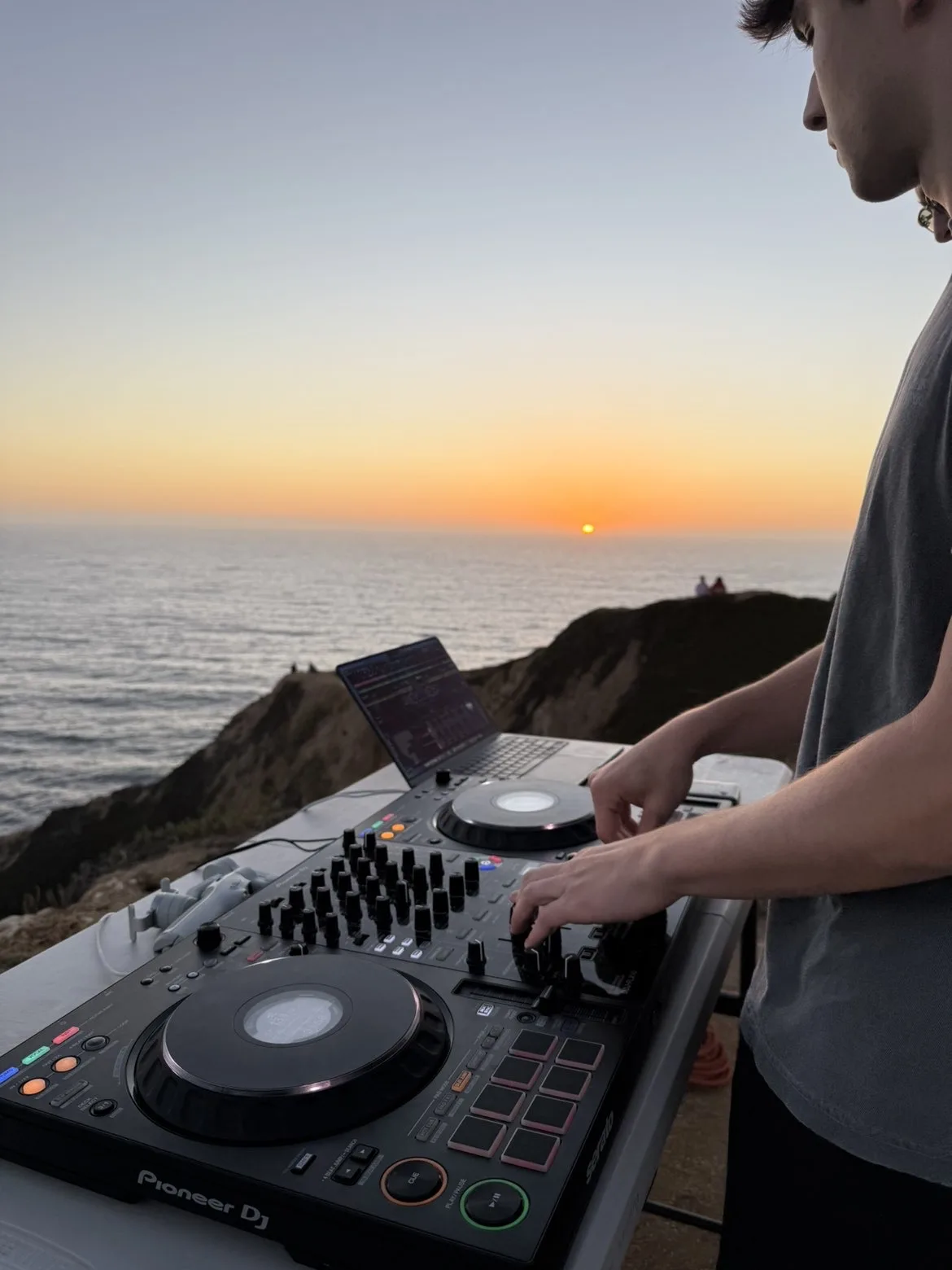 Close view of Alex mixing at sunset above the ocean